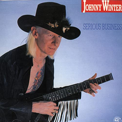 Johnny Winter album cover: musician with guitar, wearing a hat.