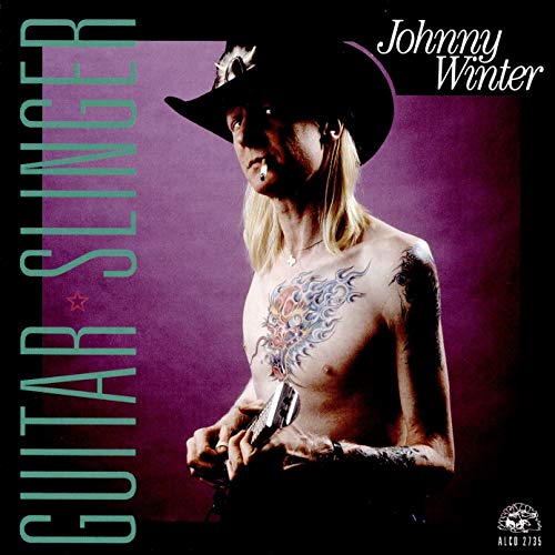Johnny Winter album cover, featuring a shirtless musician with tattoos and a cowboy hat.