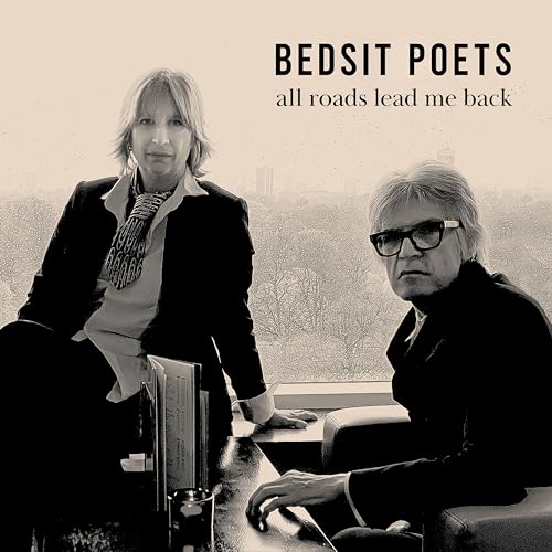 Black and white CD cover featuring two people and city skyline.