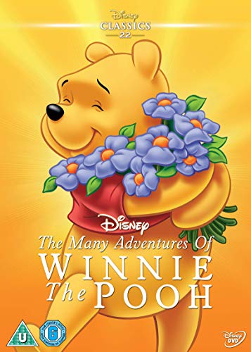 Winnie the Pooh holding purple flowers on DVD cover.