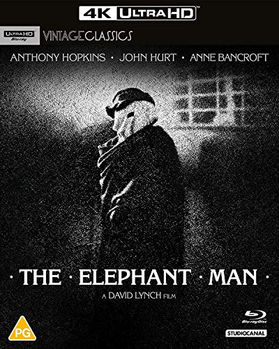 Black and white movie poster for "The Elephant Man" with a shadowed figure.