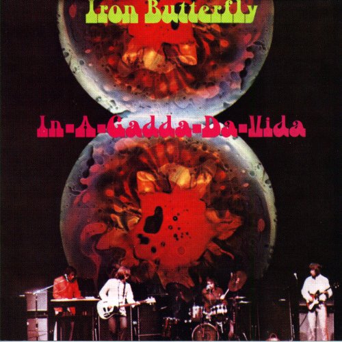 Iron Butterfly album cover: psychedelic swirls, band performing below.