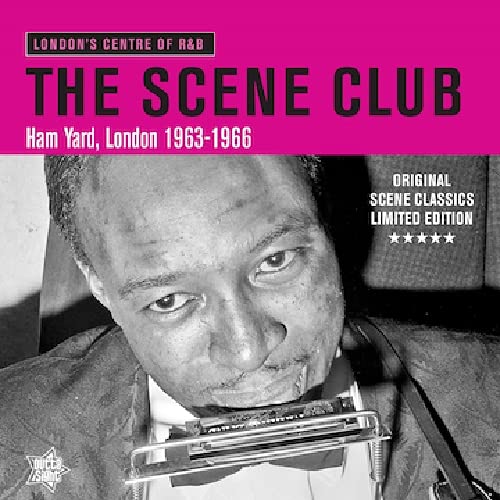 Black and white portrait of a man playing a harmonica, pink background.
