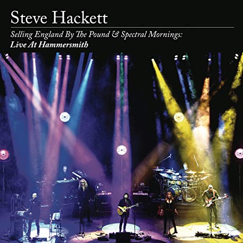 Steve Hackett live concert image with musicians on a dark stage.