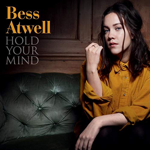 Bess Atwell album cover featuring a woman in a mustard shirt.