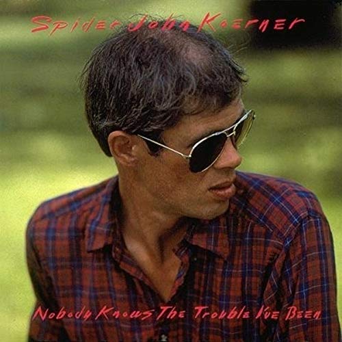CD cover featuring John Koerner in sunglasses and a plaid shirt.
