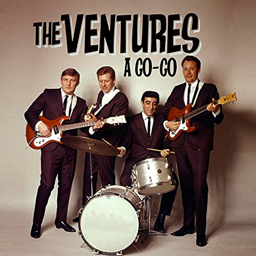 The Ventures band in suits with guitars and drums, album cover.