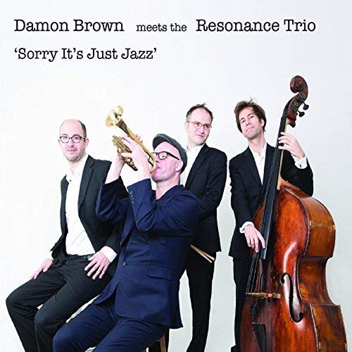 Jazz quartet with trumpet, bass, and men in suits on album cover.