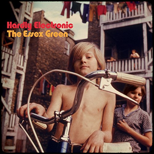 Boy with bicycle in front of a building, album cover.
