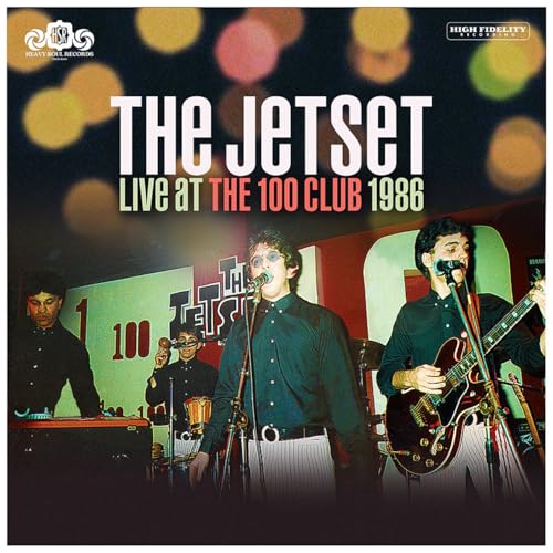 Vinyl record cover featuring a 1986 live band performance photo.