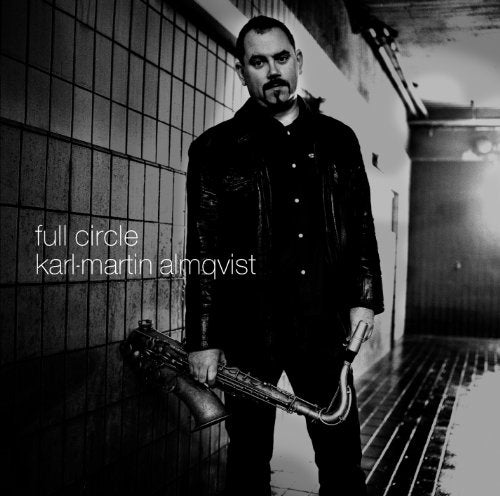 Black and white album cover featuring a man with a saxophone.