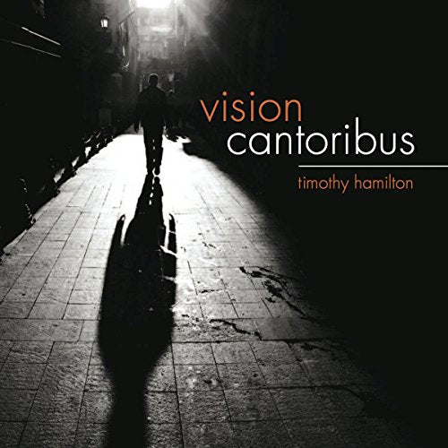 CD cover: silhouetted figure walking down a lit, cobblestone street.