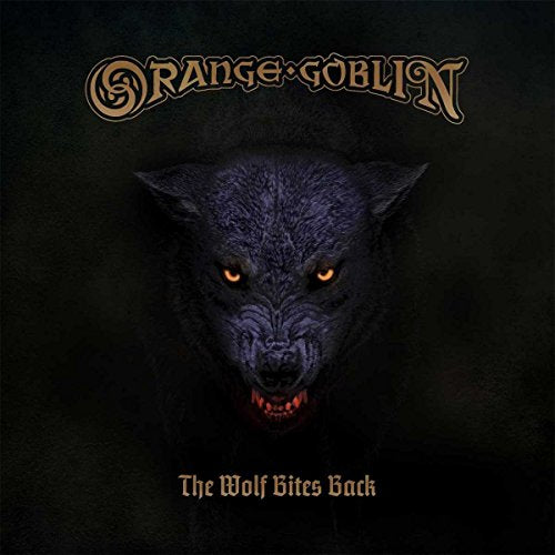 CD cover: dark blue wolf face with glowing yellow eyes, band logo.