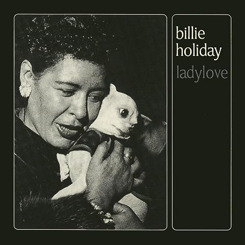 Billie Holiday holding a small white dog, album cover art.