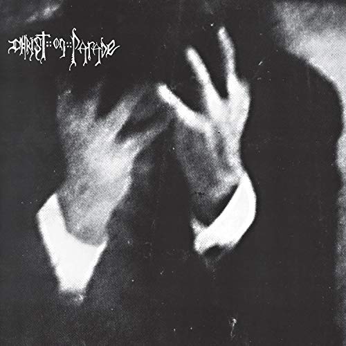 Black and white album cover with hands covering a face.