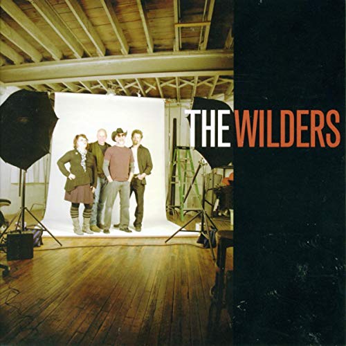 CD cover featuring a band of four people in a studio setting.