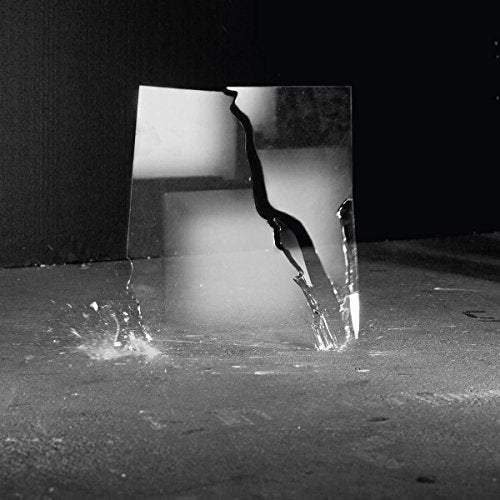 Black and white photo of a shatteredSCH cracked pane of glass.SCCCH glass.