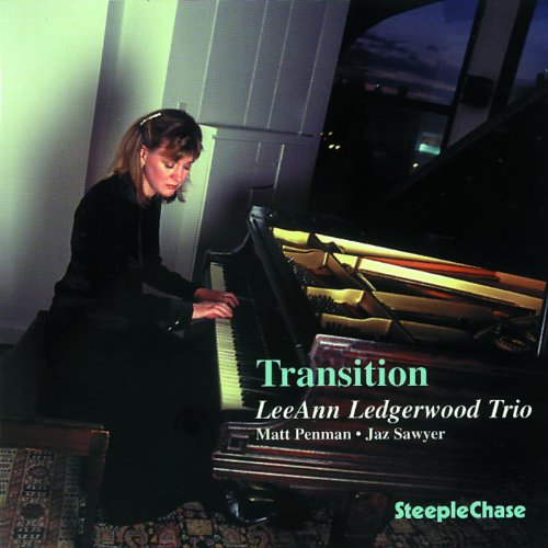 Woman playing a grand piano on the album cover “Transition”.