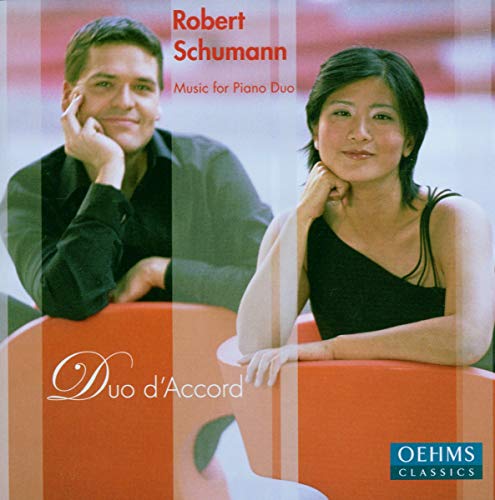 CD cover featuring two musicians, a man and a woman, at a piano.