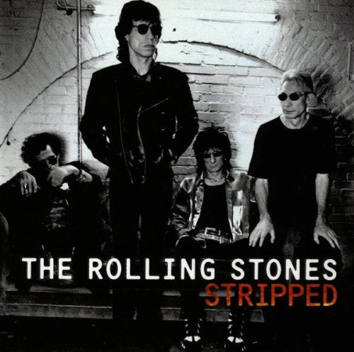 Black and white photo of The Rolling Stones, album cover for "Stripped".