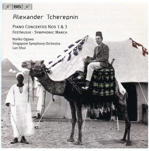 CD cover: Man on camel with musicians in a desert landscape.