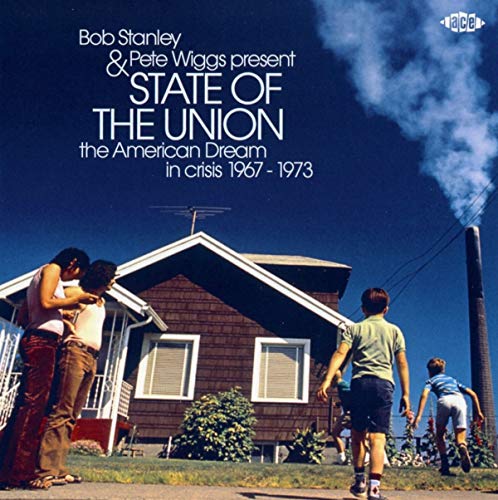 CD cover: family near a house, smoke rising in a blue sky.