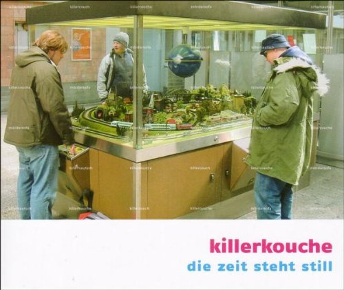 CD cover: three people view a detailed model train landscape in a display case.