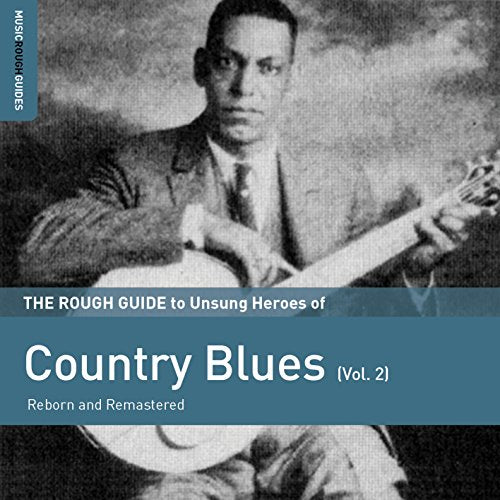 Vintage photo of a blues musician with a guitar, album cover art.