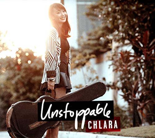 Young woman with guitar, album cover for Chlara’s “Unstoppable.”