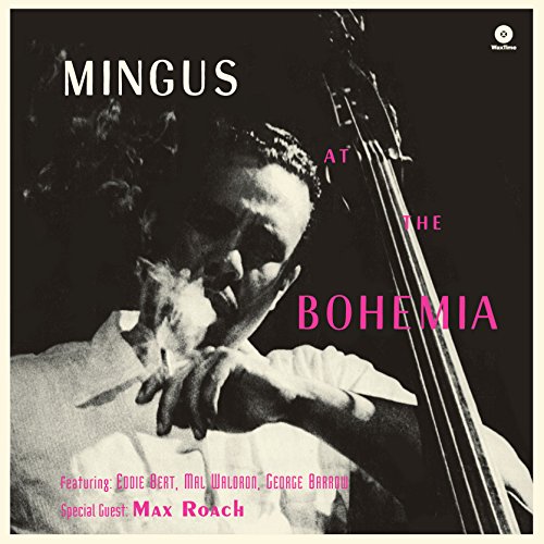 Black and white album cover featuring Charles Mingus playing a double bass while smoking.
