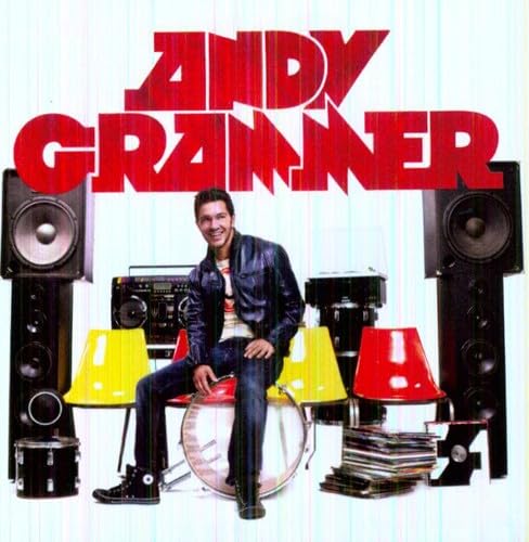 Andy Grammer album cover featuring the artist with musical instruments.