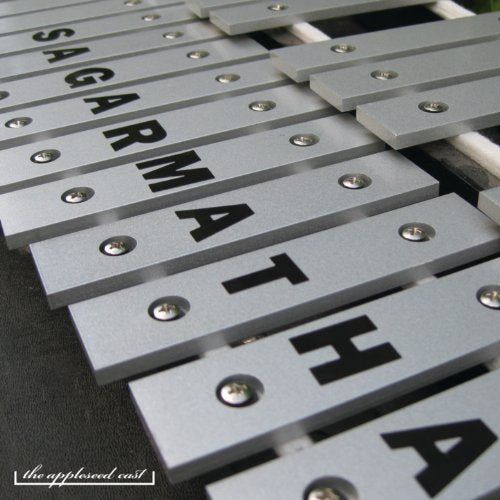 Close-up of metal xylophone bars spelling "SAGARMATHA" with band logo.