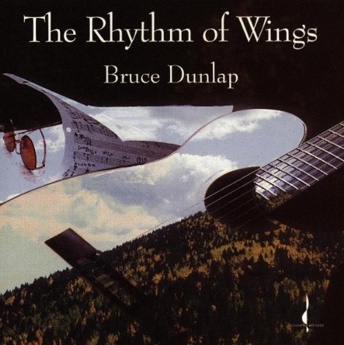 CD cover featuring a guitar, sheet music, and airplane wing silhouette.