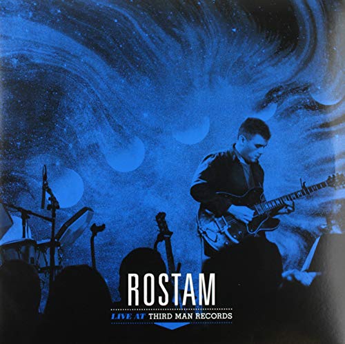 Blue vinyl record cover featuring Rostam playing guitar on stage.
