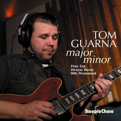 Tom Guarna plays a sunburst guitar, wearing headphones, album cover.
