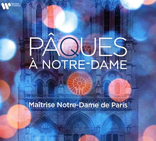 CD cover featuring Notre-Dame de Paris cathedral with orange bokeh lights.