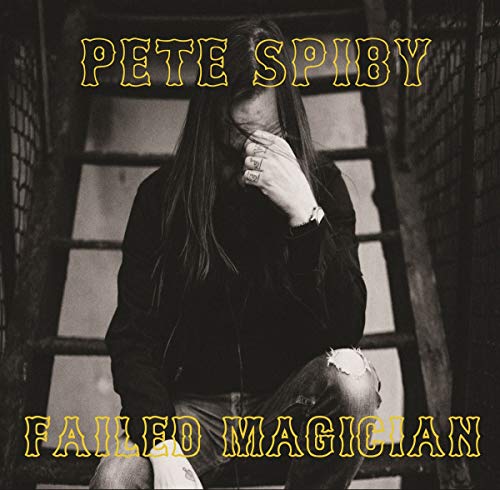 Black and white album cover featuring a person with covered face.