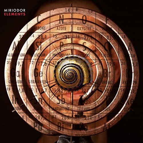 CD cover with a spiral of elemental symbols and a seashell center.