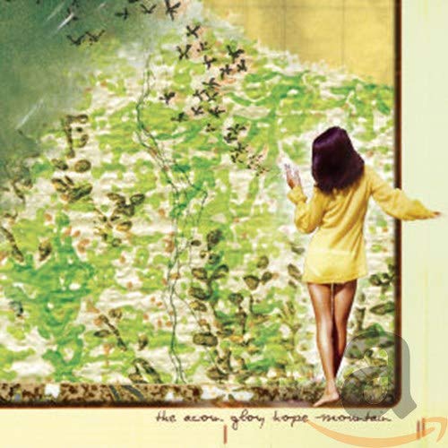 CD cover: woman in yellow reaching towards a flock of birds.