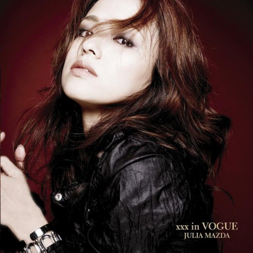 Julia Mazda album cover, close-up portrait of a woman with dark hair.