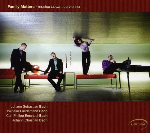 CD cover: four men and a woman in formalwear, abstract background.