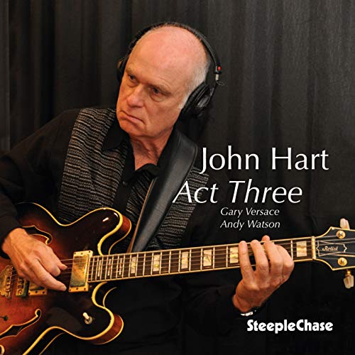 John Hart album cover: man with guitar, headphones, and text.