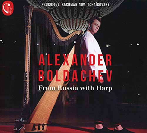 Alexander Boldachev stands with a large, golden harp on a dark background.