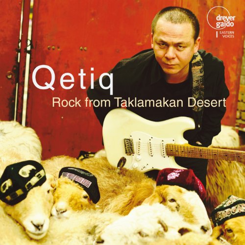 Man with guitar surrounded by sheep, album cover for Qetiq.