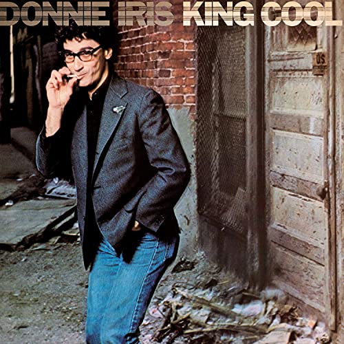 Donnie Iris album cover, man in jacket leaning against a door.