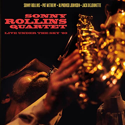 CD cover: Sonny Rollins playing saxophone with warm, golden lighting.