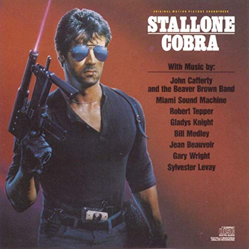 CD cover for "Cobra" soundtrack featuring Sylvester Stallone with sunglasses.