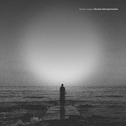 Black and white album cover featuring a lone figure facing the ocean.