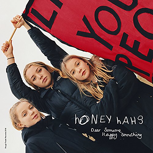 CD cover featuring three young people and a red banner with text.
