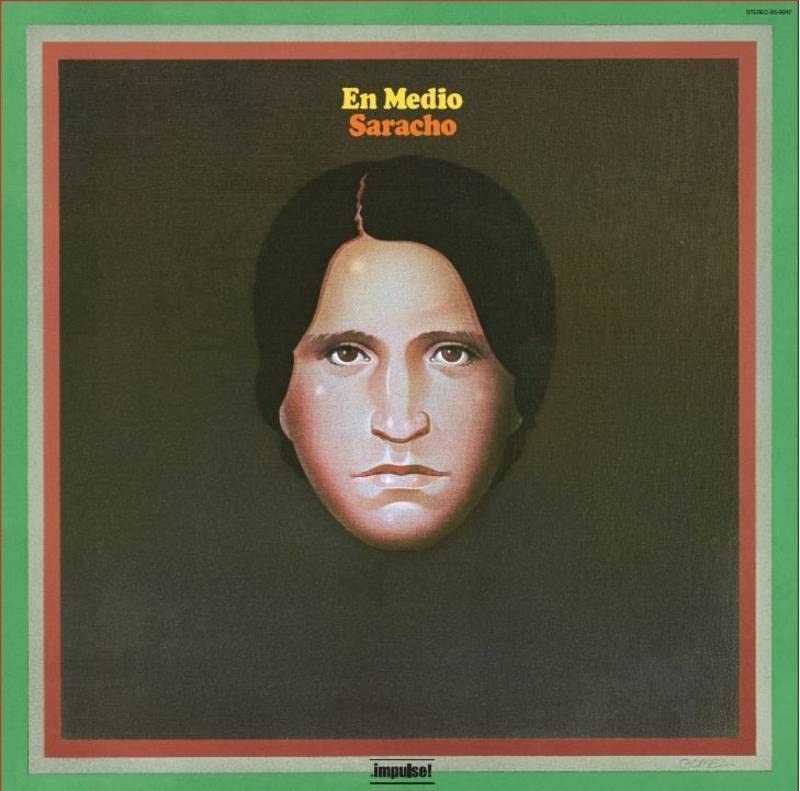 Vinyl album cover: portrait of a man with green and brown background.